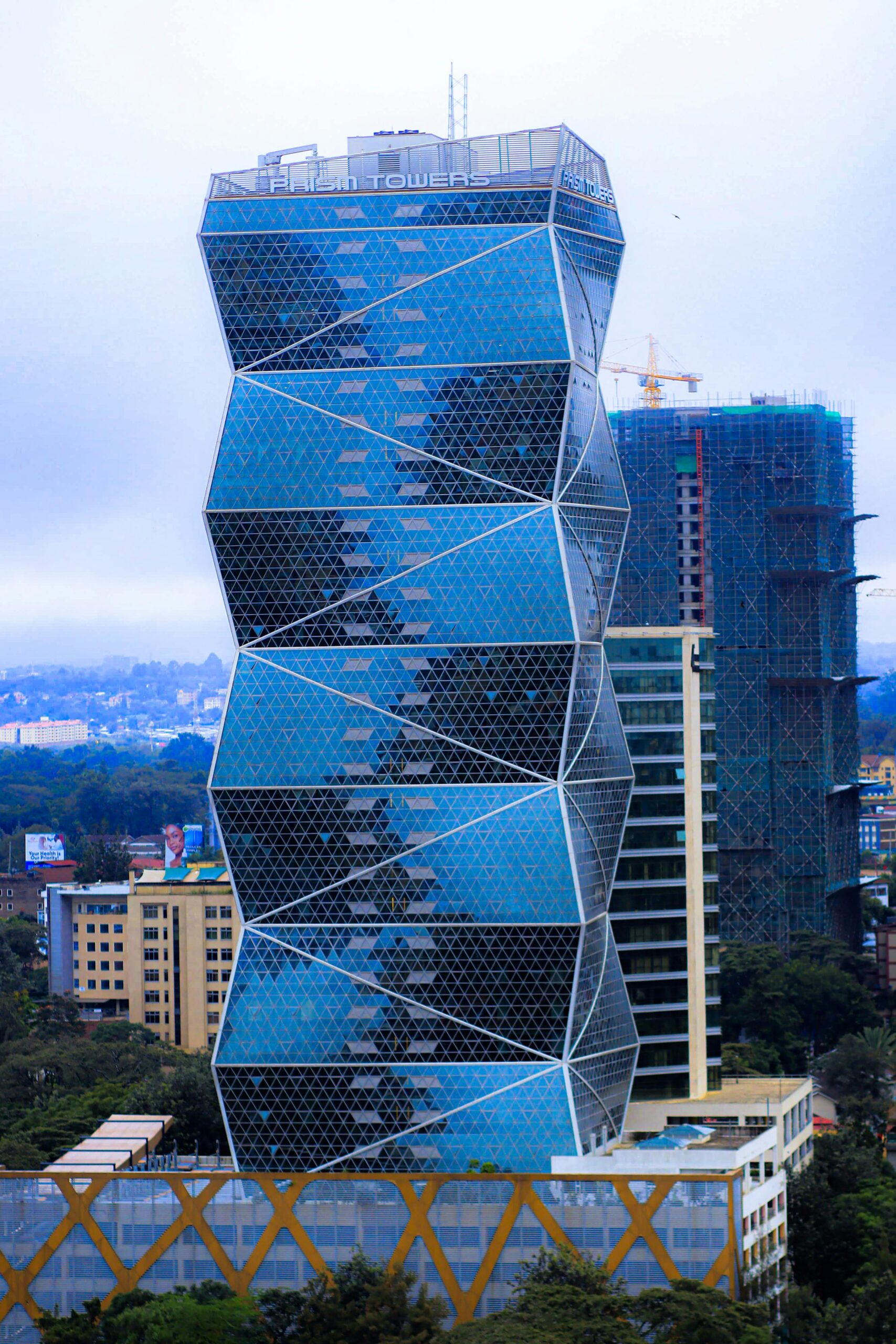 A modern skyscraper with a unique facade in Nairobi's central business district.